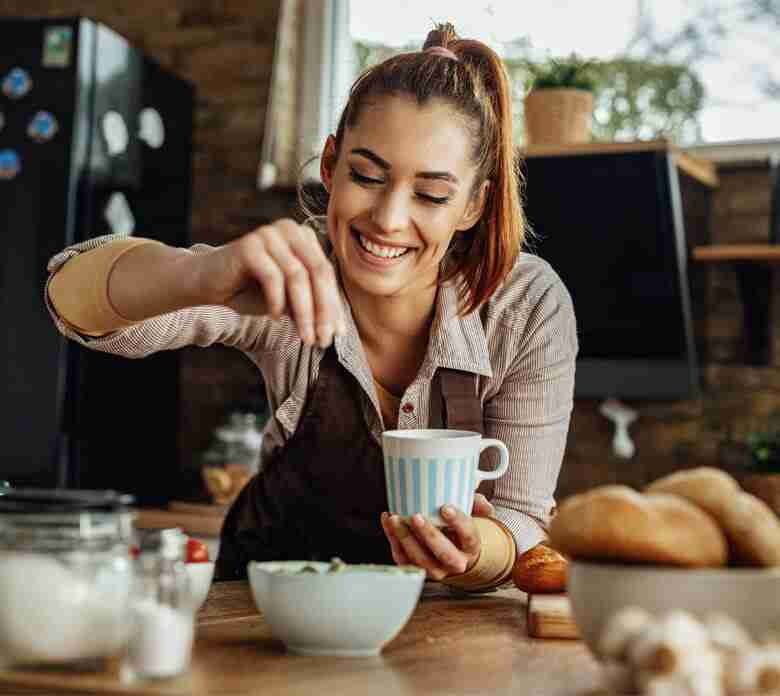 Woman Seasoning Salad